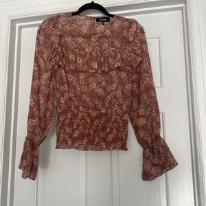 Sheer pink floral top.